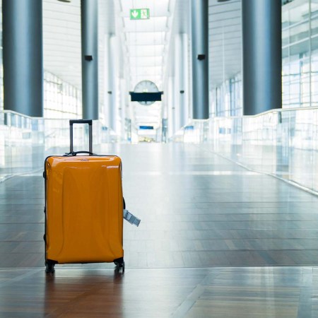 A yellow suitcase sits in the hall of an international airport. We take a look at the airports and airlines mishandling baggage in the U.S.