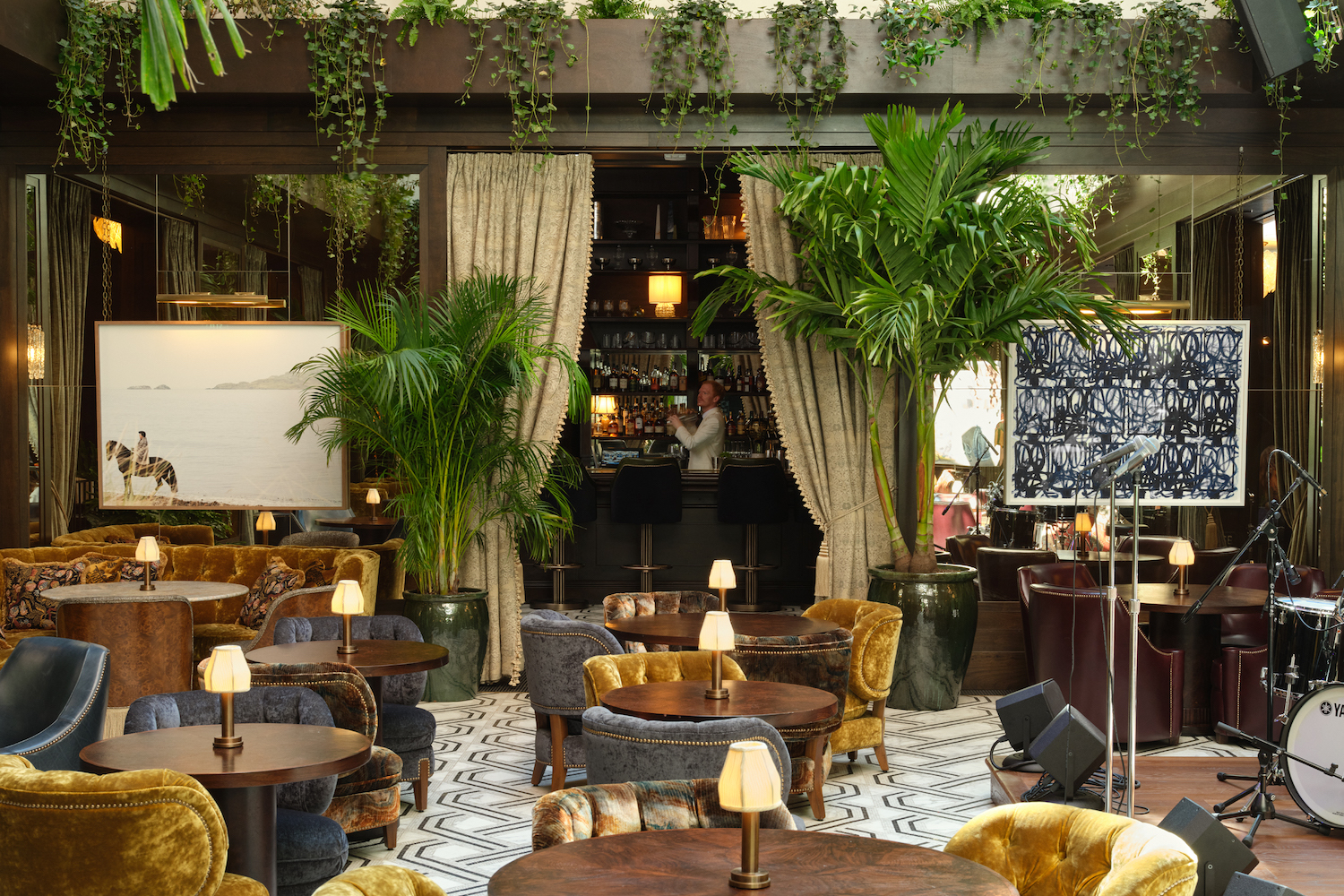 the plant-filled atrium at the ned new york