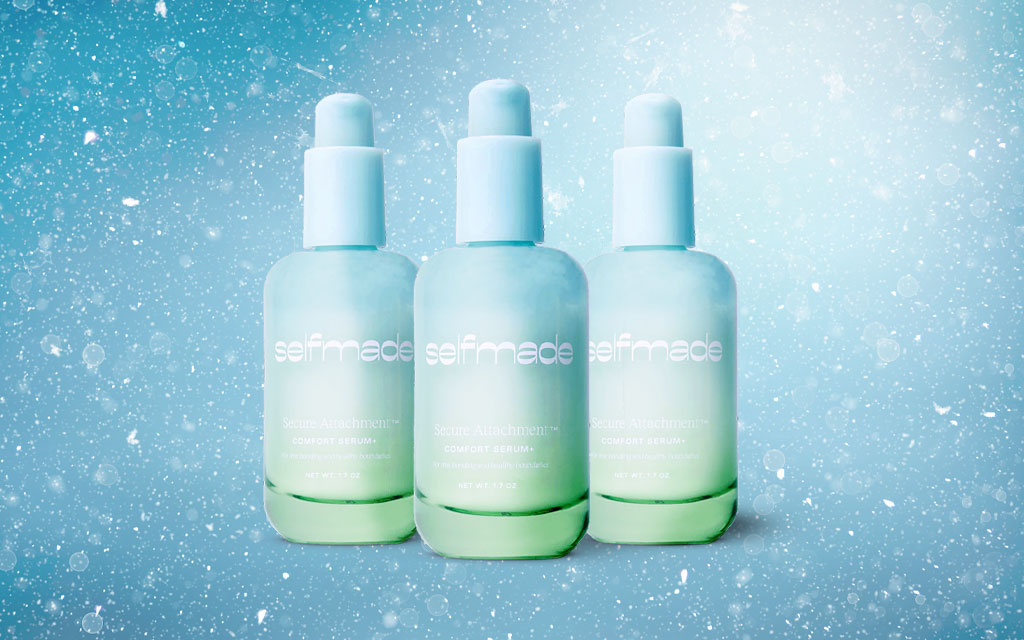 Three bottles of Selfmade's serum, a great holiday gift for women, on a blue wintery background