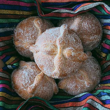 A basket of Pan de Muerto bread