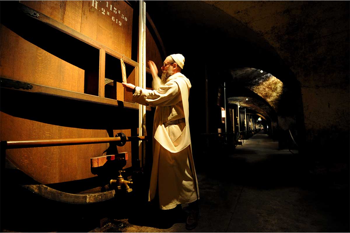 Brother Jean-Jacques, one of the two monks who knows the secret receip of the Chartreuse liqueur, checks the level of "foudres" (big barrels) of Chartreuse in the biggest liqueurs cellar in the world on November 25, 2011 in Voiron. The liqueur is named after the Monks' Grande Chartreuse monastery, located in the Chartreuse Mountains near Grenoble, French Alps. Chartreuse gives its name to the color chartreuse. It is one of the handful of liquors that continues to age and improve in the bottle.