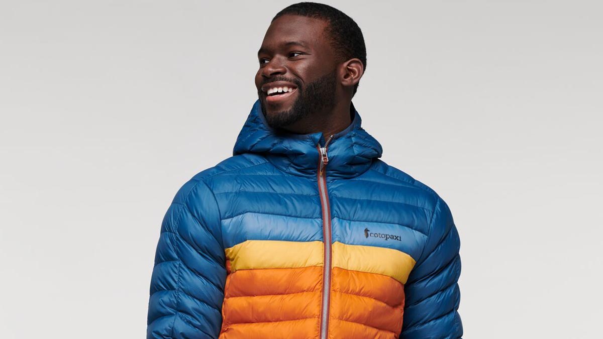 A man wearing Cotopaxi's Fuego Hooded Down Jacket, now on sale