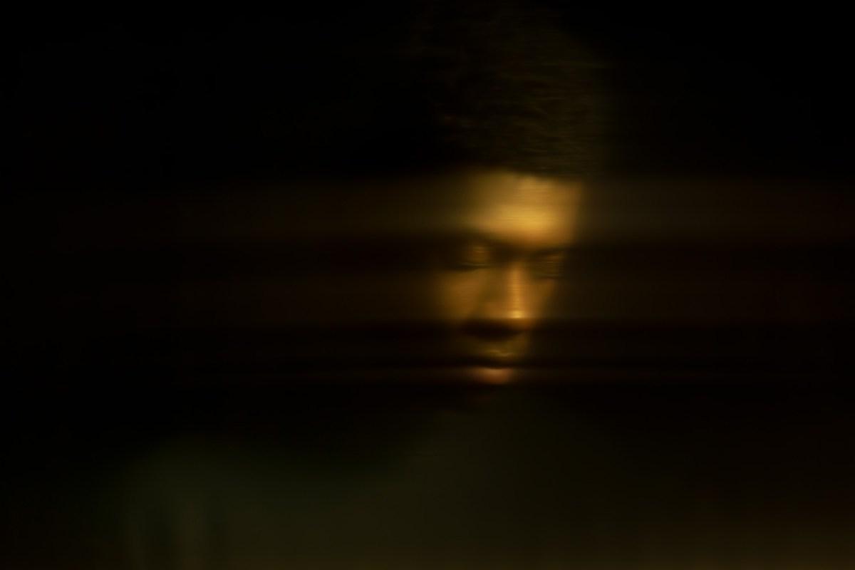 Blurry photo of a Black man on a black background