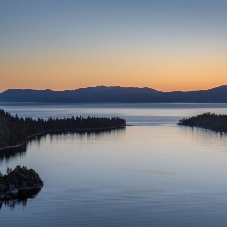 Sunrise over Lake Tahoe's Emerald Bay, one of the best places to hike in the fall
