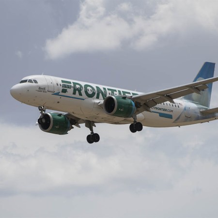 A Frontier Airlines flight prepares to land at Denver International Airport in Denver, Colorado, US, on Wednesday, June 29, 2022. Frontier will offer an unlimited travel plan in 2023 for select travelers