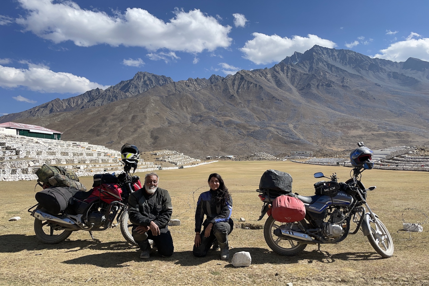 ghazal and Qazi Farooqi posing with their motorcycles in the high-altitude Katpana Desert
