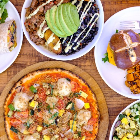 An overhead photo of dishes from Love Life Cafe, a vegan restaurant in Miami that's a favorite of baker Pamela Wasabi