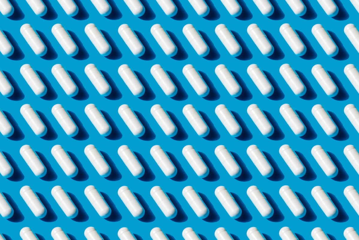 White capsules on a blue background.