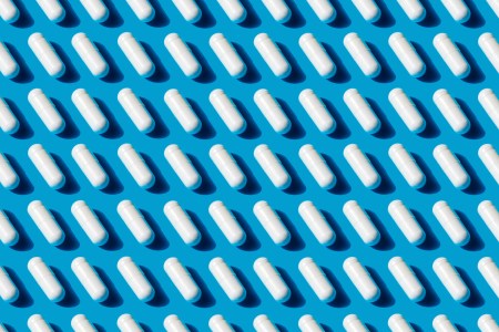 White capsules on a blue background.