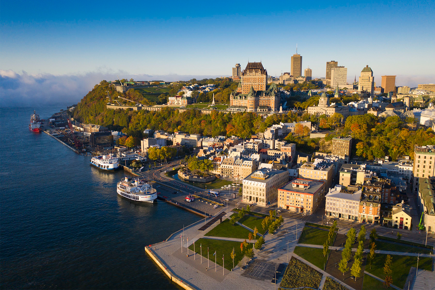 Québec City as seen from the air, with a view of the Saint Lawrence River. Here's our travel guide about how to spend the perfect weekend in Quebec's capital city.