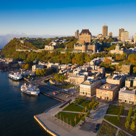Québec City as seen from the air, with a view of the Saint Lawrence River. Here's our travel guide about how to spend the perfect weekend in Quebec's capital city.