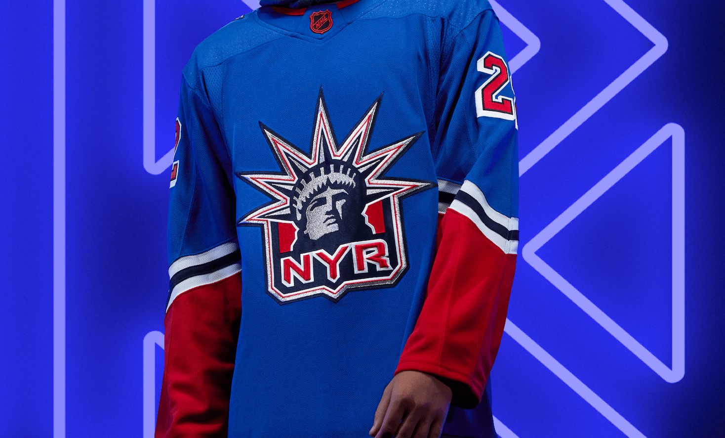 Many of our jerseys reenergize classic logos like the “Lady Liberty” you see on this year’s Rangers edition. This time, she’s back with an exciting twist in the new red color-blocking and navy stripes.