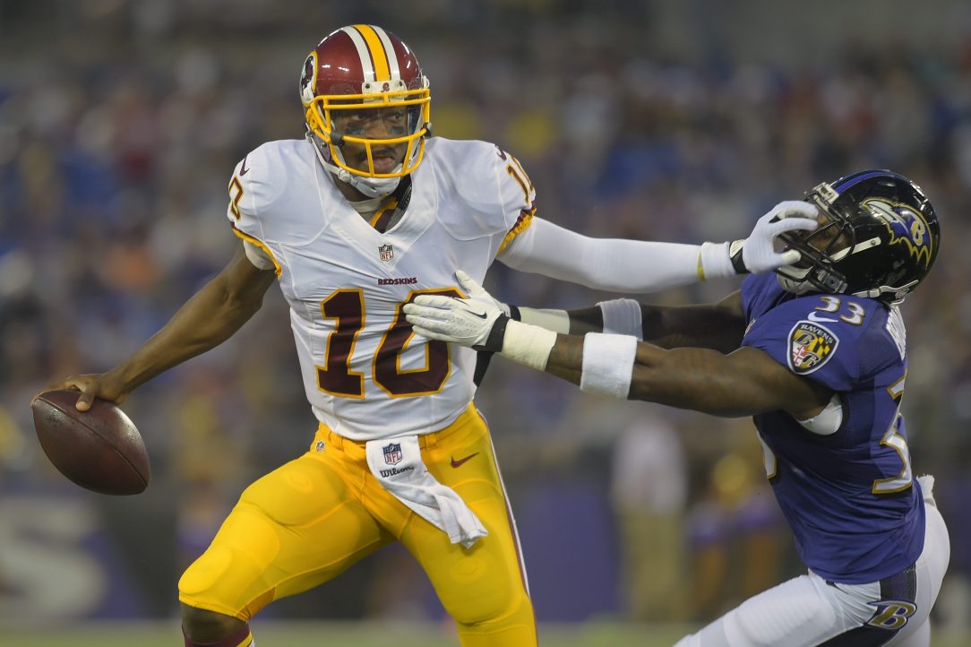 Ex-Washington quarterback Robert Griffin III pushes off a Baltimore during a road game.