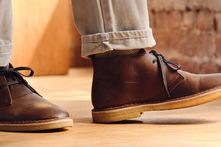 A man walking in Mason Chukka boots by Rhodes Footwear, now on sale at Huckberry