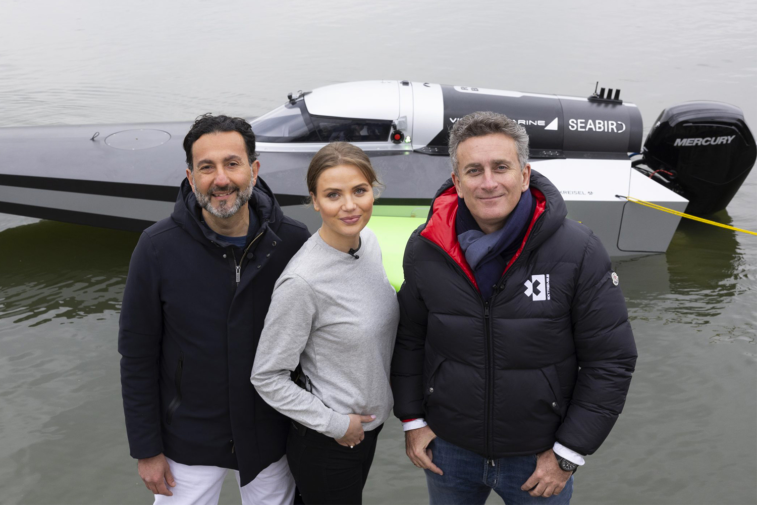 Rodi Basso, Sophi Horne and Alejandro Agag standing in front of the RaceBird, the electric boat that will race in the E1 Series