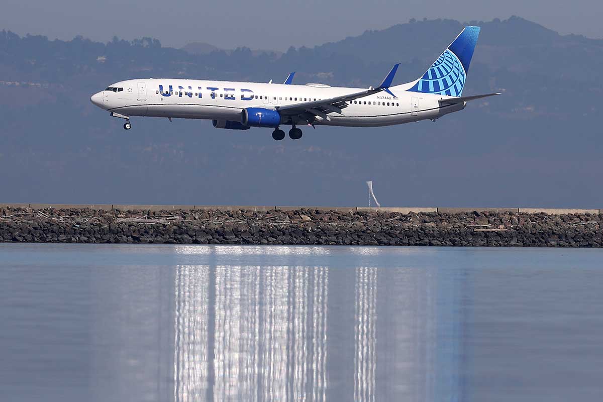 A United Airlines plane lands at San Francisco International Airport on October 19, 2022 in San Francisco, California. United has starting introducing a new type of Economy ticket that