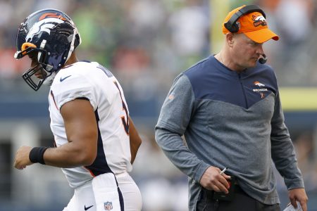 Russell Wilson and head coach Nathaniel Hackett of the Denver Broncos.