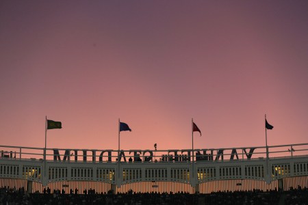 Sunset outside the frieze at Yankee Stadium. Here's why the New York Yankees need to have a losing season.