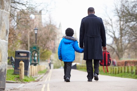 A father walking his son to school. A new study looks at "dad brain," or how the brain changes during early fatherhood.