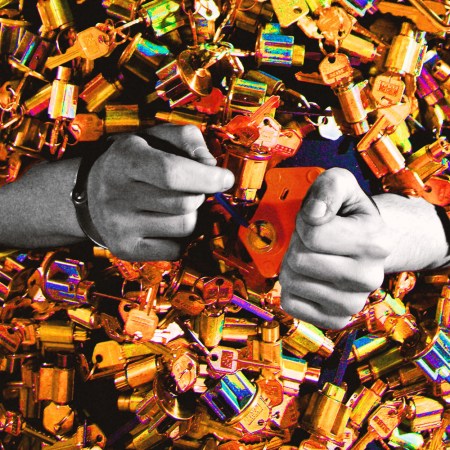 Two hands in a sea of locks