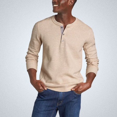 A model in a cream Eddie Bauer Thermal Henley on a grey background
