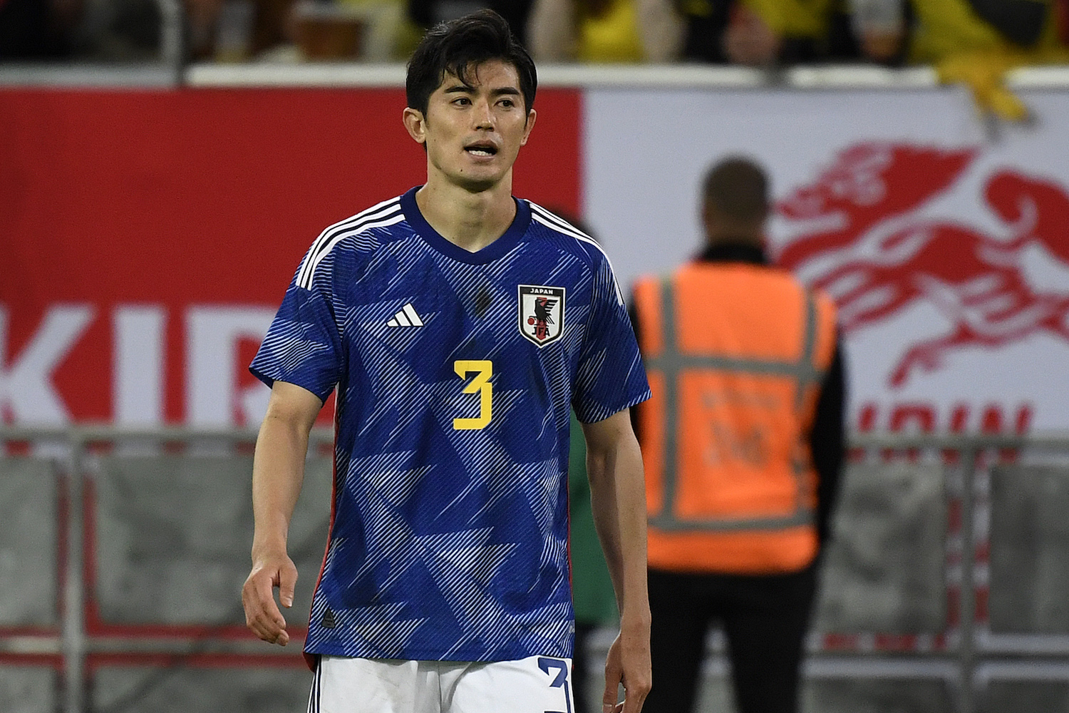 a Japanese soccer player in a blue jersey