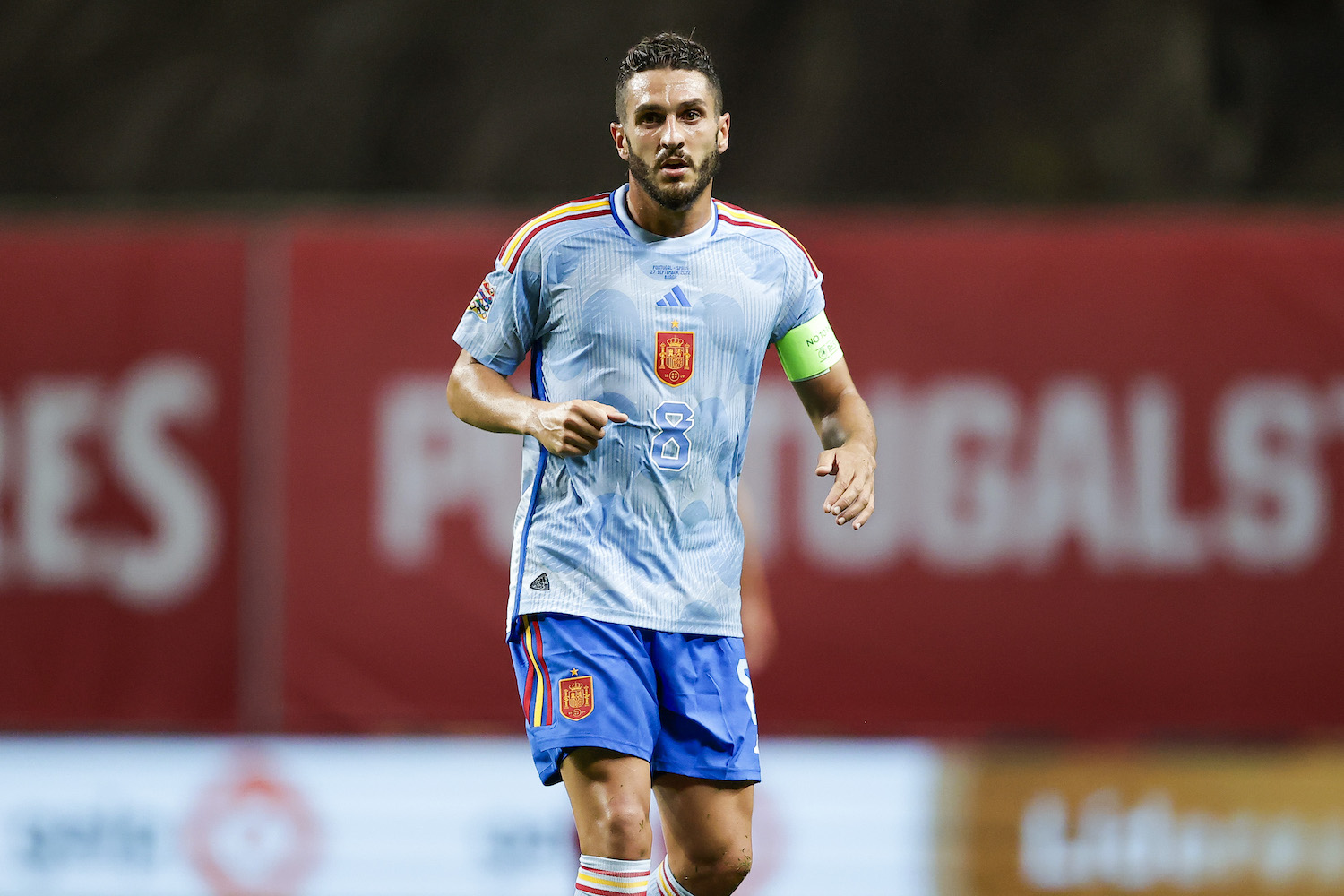 a Spanish soccer player in a blue jersey