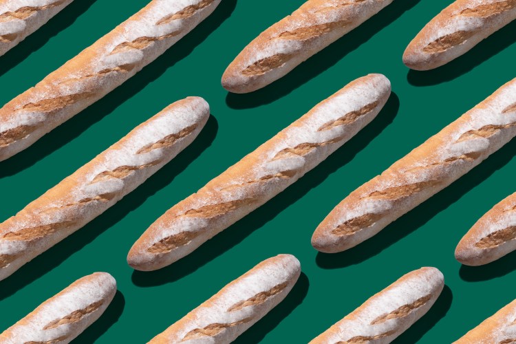 Baguette Long Loaf on Solid Green Colored Background Arrangement Pattern