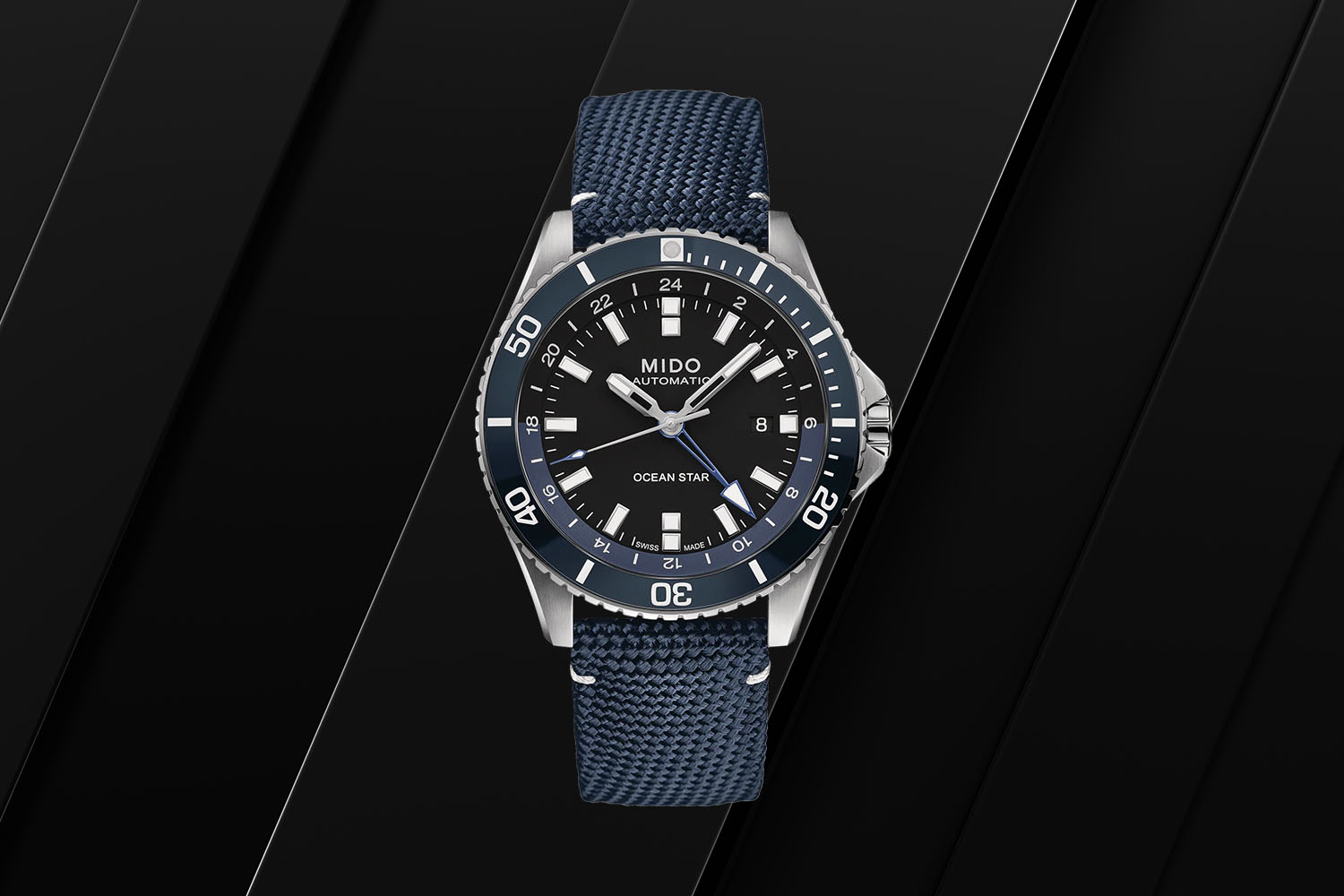 One of the best GMT watches, Mido Ocean Star GMT on a black background 