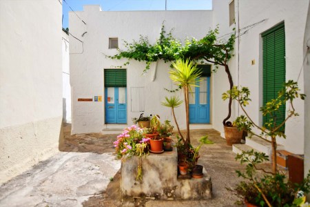 A small street between the old houses of Presicce, a picturesque village in the province of Lecce.