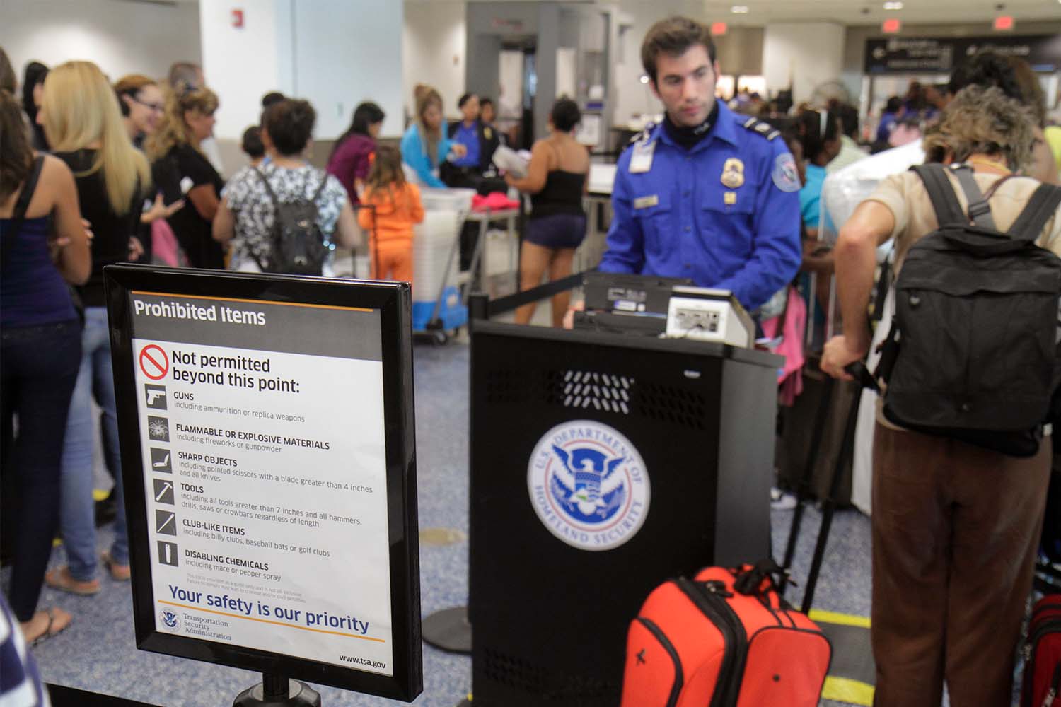 A prohibited items sign at the TSA security checkpoint in Miami International Airport.