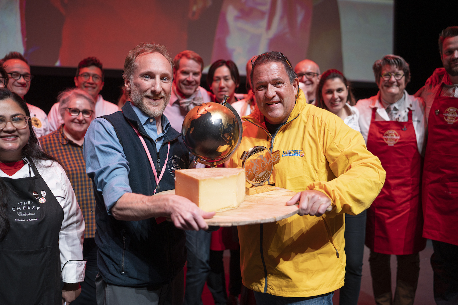 Joe Salonia and Dennis Kaser holding the winning cheese at world cheese awards 2022