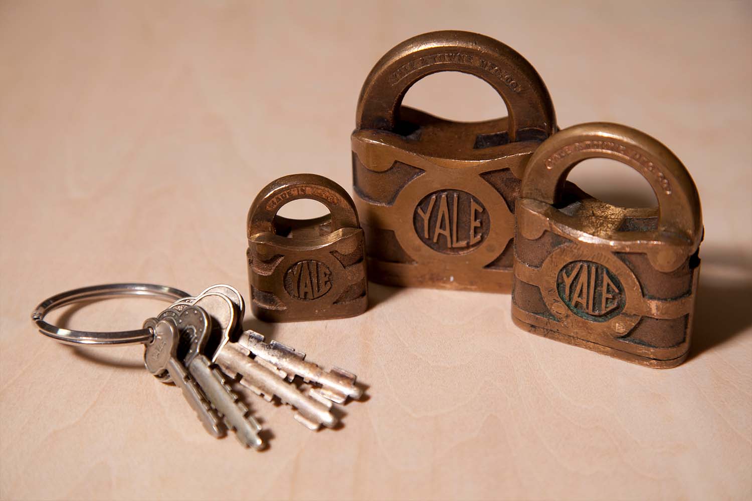 Three Yale locks with keys