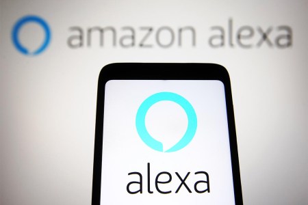 In this illustration, an Amazon Alexa logo is seen on a phone and computer screen. The voice assistant is in trouble, losing billions and leading to massive layoffs.