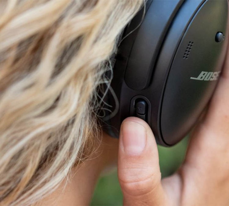 A person wearing Bose headphones, close-up. Bose's Black Friday sale has started early