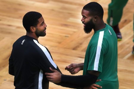 Kyrie Irving and Jaylen Brown spend a moment together before a game.