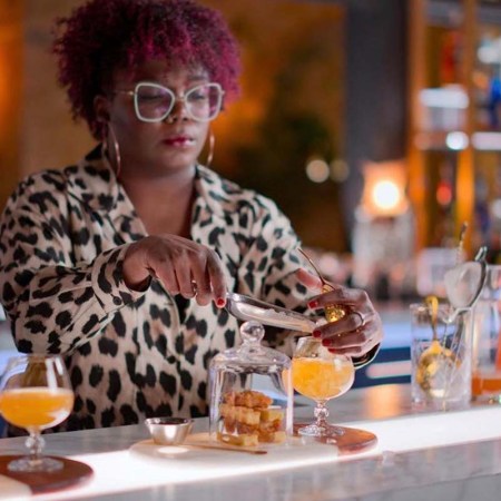 Lauren “LP” Paylor O’Brien at a bar making a drink. The Silver Spring, Maryland, resident is the winner of Netflix's Drink Masters show