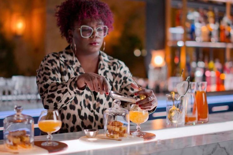 Lauren “LP” Paylor O’Brien at a bar making a drink. The Silver Spring, Maryland, resident is the winner of Netflix's Drink Masters show