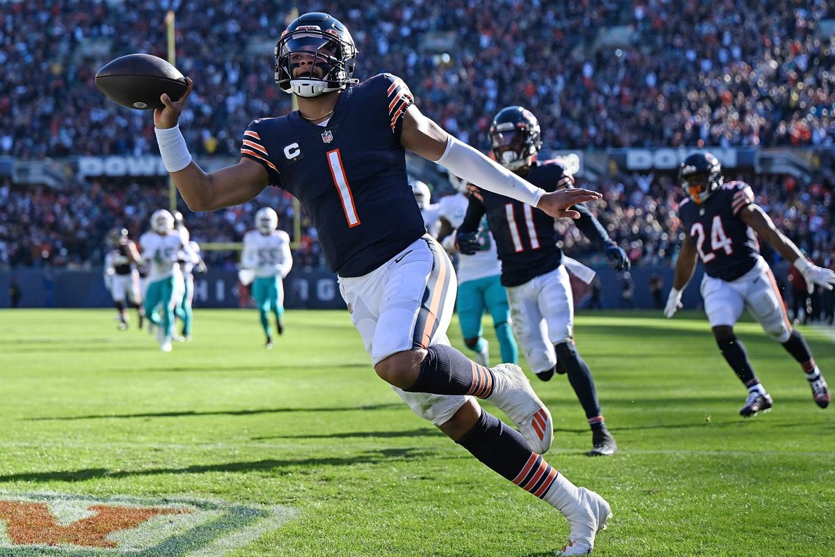 Justin Fields of the Bears scores a touchdown against the Dolphins.