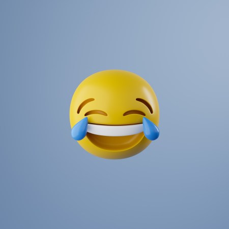 The crying laughing emoji against a blue background.