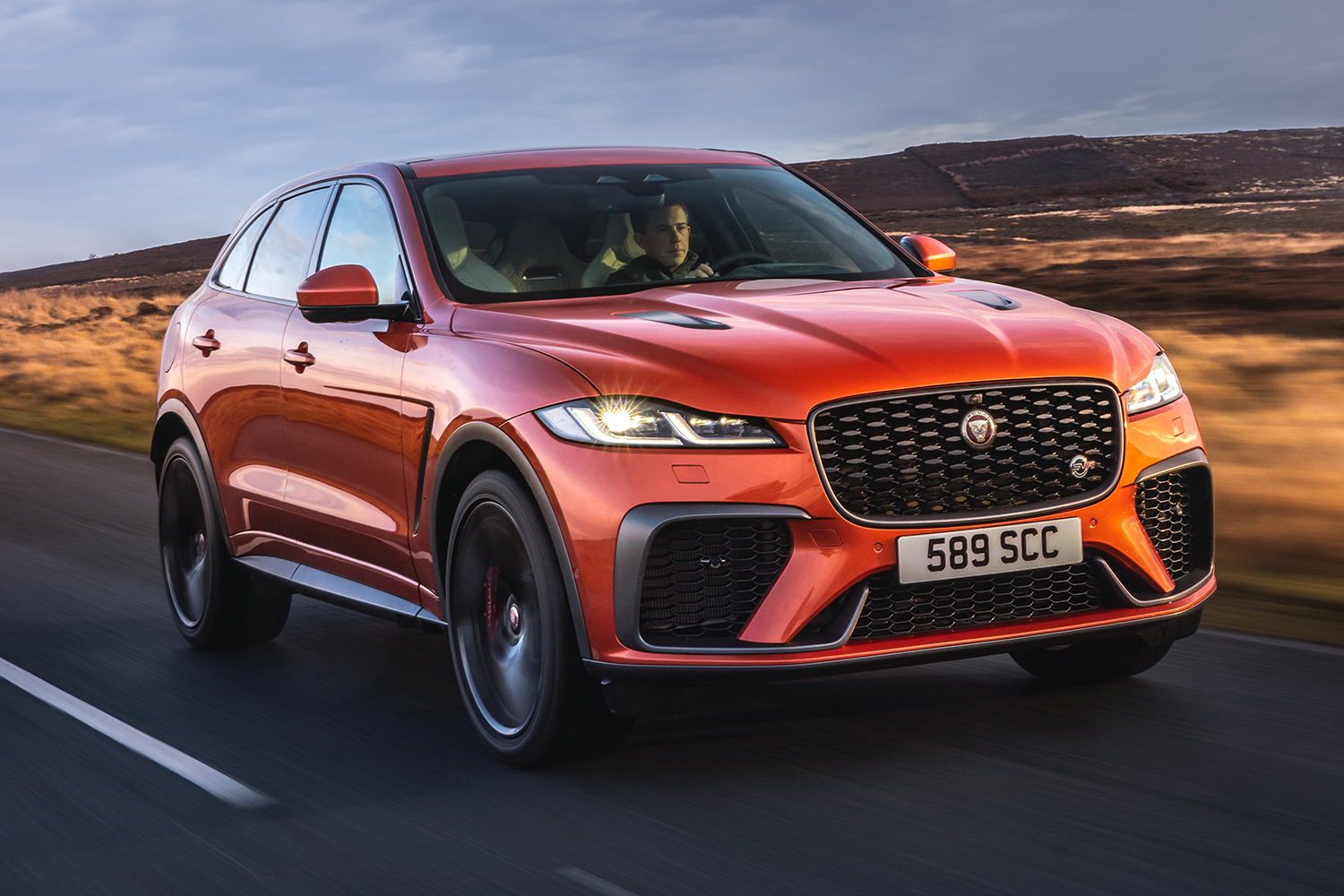 A man drives the Jaguar F-Pace SVR, a high-performance British SUV with a V8 engine