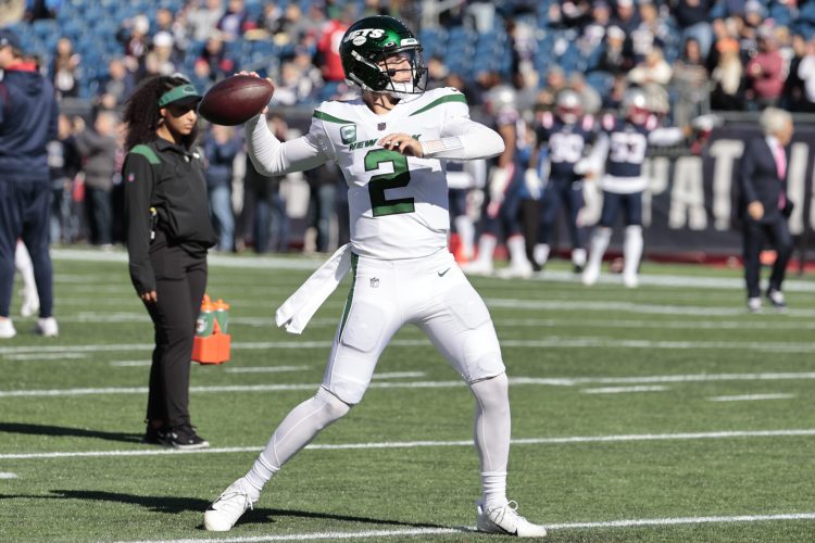 New York Jets quarterback Zach Wilson warms up before a game.