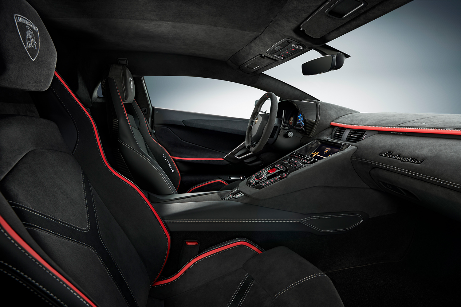 The interior of a Lamborghini Aventador Ultimae, with black seating outlined in red accents