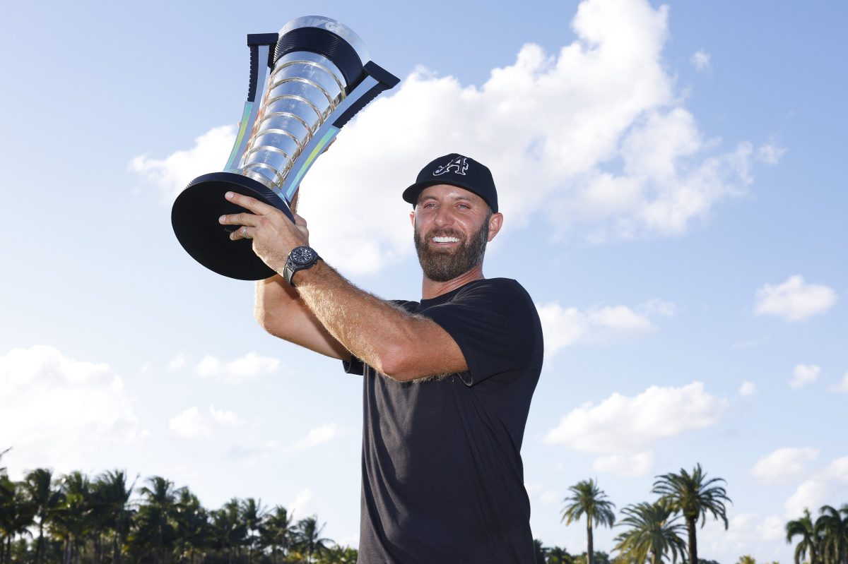 Dustin Johnson celebrates after winning at the LIV Golf Invitational - Miami. The golfer is apparently making up to 1,000% more after his switch from the PGA.