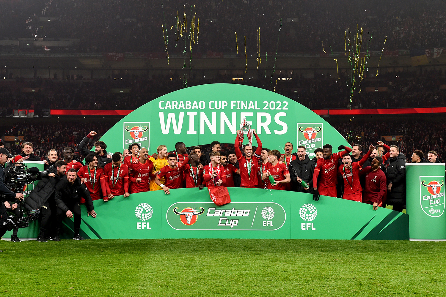 Jordan Henderson captain of Liverpool lifting the EFL Carabao Cup trophy at the end of the Carabao Cup Final match between Chelsea and Liverpool at Wembley Stadium on February 27, 2022 in London, England.