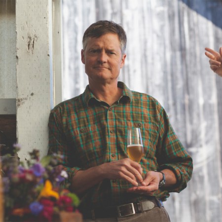 Gordon Hull, the brewer behind Heidrun Meadery, holds a glass of mead