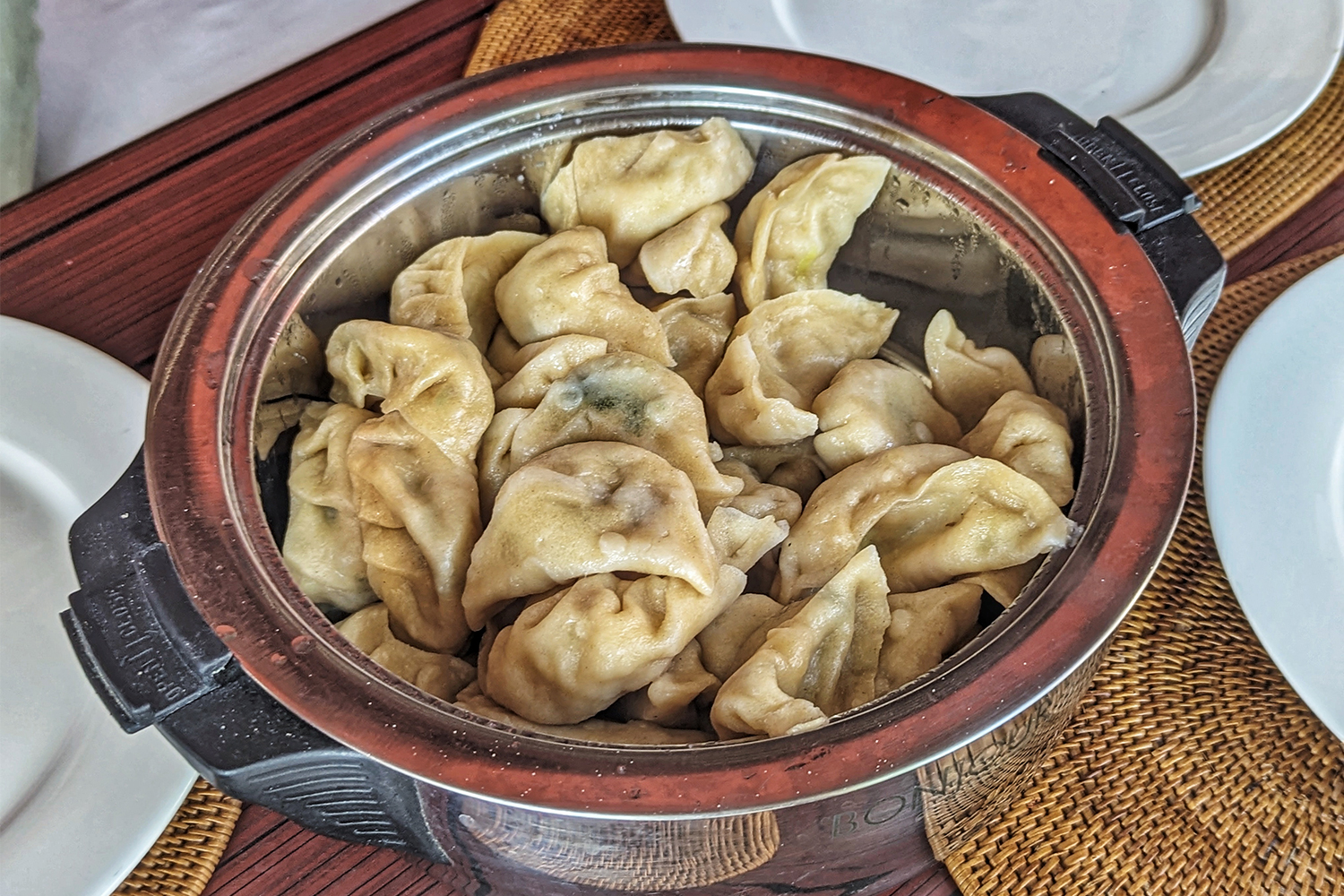 A pot of momos, traditional Tibetan dumplings, at a refugee camp in Nepal