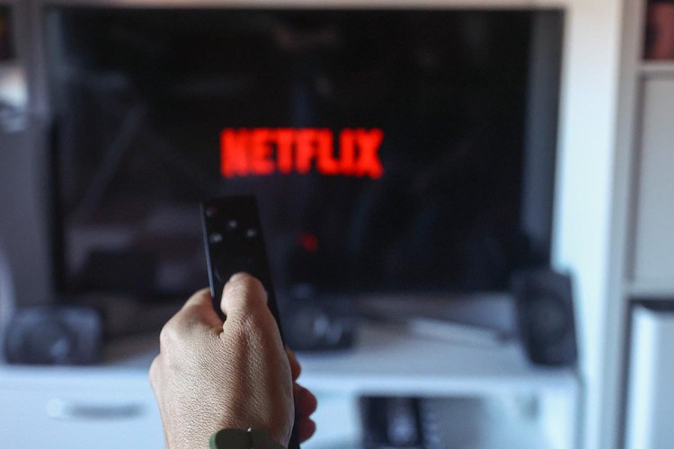 A user connects to the Netflix streaming platform on a TV. Here's what the service's new Basic With Ads subscription is like.