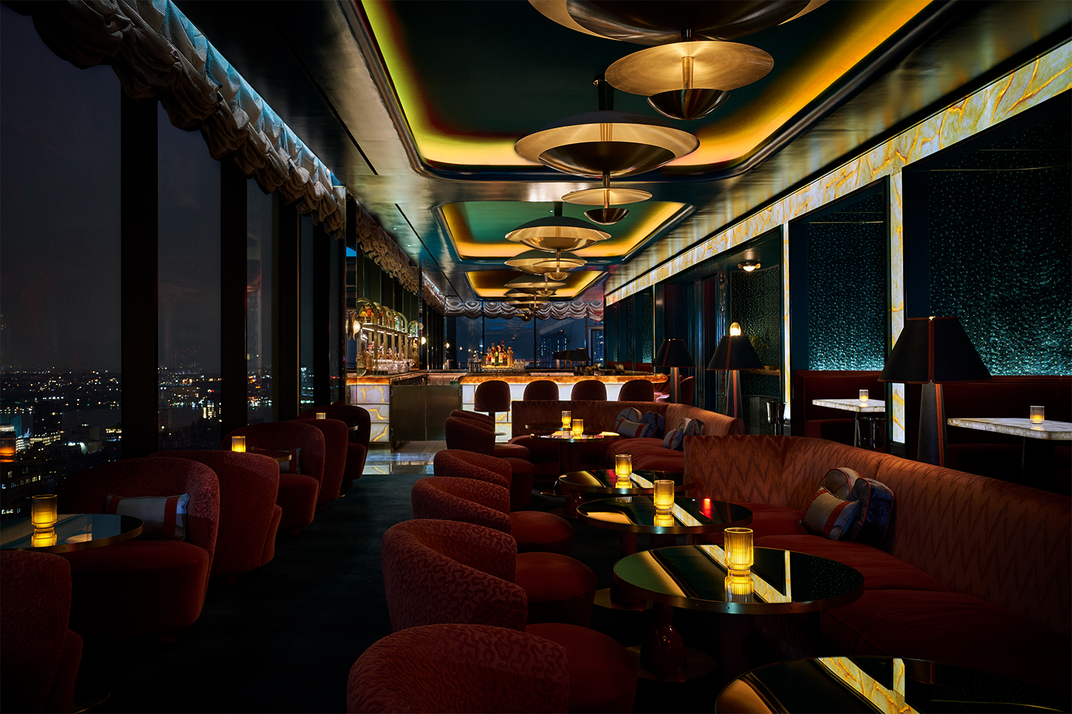 The inside of Nubeluz, the rooftop bar at The Ritz-Carlton New York, NoMad, shown at night