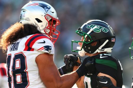 Jahlani Tavai of the Patriots and Braxton Berrios of the Jets get into a scuffle in Week 8.